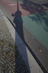 Wall Mural - Person shadow in the street