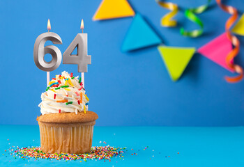 Birthday cake with candle number 64 - Blue background