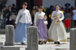 Tourists experience history wearing hanbok, a traditional costume, at the Gyeongbokgung Palace, a royal palace of the Joseon Dynasty in downtown Seoul.