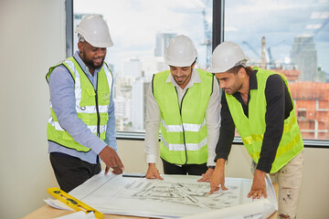 group of engineers meeting and talking about work or projects on construction site