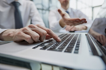 Wall Mural - Male hands or men office worker typing on the keyboard