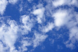 Fototapeta Desenie - Blue sky with white fluffy clouds.