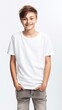 © StasySin - AI generated. T-shirt mockup. Cute smiling teenager 10 years boy in a white T-shirt on a clean background Generative AI