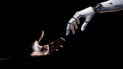 the robot's hand touches the human hand on a black background. the concept of helping artificial int