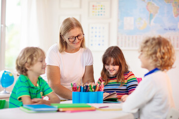 Wall Mural - Kids in school. Children in class.