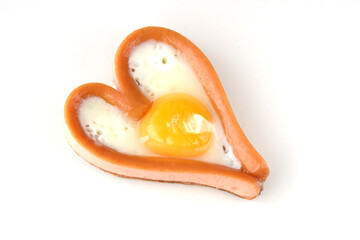 Wall Mural - heart sausages with fried eggs for lovely breakfast