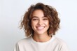 © Robert MEYNER - Portrait of beautiful young woman with curly hair on white background.