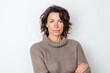 © Robert MEYNER - Portrait of a beautiful middle-aged woman in a sweater on a white background