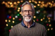 © Robert MEYNER - Portrait of a senior man with glasses against blurred christmas lights