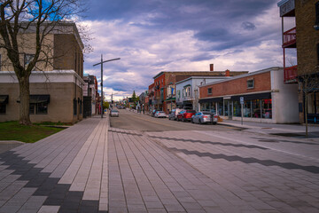 Wall Mural - Canada Quebec Magog City downtown skyline, buildings, street, and dramatic cloudscape in the sky at sunset