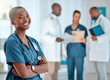 © Kirsten D/peopleimages.com - Hospital, happy doctor and portrait of black woman for medical care, insurance and wellness. Healthcare, clinic nurse or face of female health worker with crossed arms for service, consulting or help