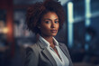 © Roman - Bllack woman in a business suit standing in a confident pose. Woman's rights equality success of African-American people generative ai