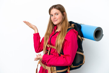 Wall Mural - Young mountaineer girl with a big backpack over isolated white background extending hands to the side for inviting to come