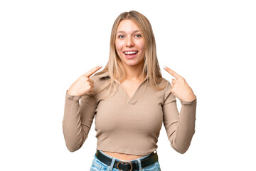 Wall Mural - Young pretty blonde woman over isolated chroma key background giving a thumbs up gesture