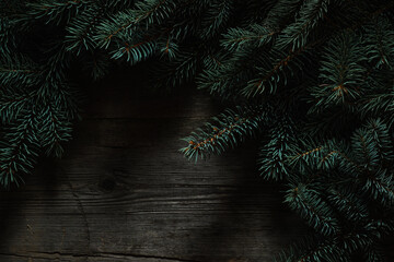 Wall Mural - Christmas green frame from fir branches on a vintage gray board back. Frame of fir branches. Christmas card blank.