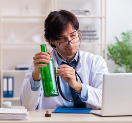 Poster - Young male doctor drinking in the office