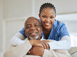 © Siphosethu F/peopleimages.com - Senior man, nurse and hug portrait on a sofa for support, healthcare and happiness at retirement home. Face of patient and black woman caregiver together for trust, elderly care or help for wellness