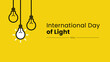 © Malimo - Digital vector illustration of a yellow poster with lightbulbs for international day of light