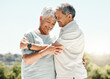 © K.A./peopleimages.com - Senior couple, hug and happy in nature on vacation, holiday or summer bonding. Love, hugging and retirement of man and woman with a smile and enjoying quality time together on intimate date mockup.