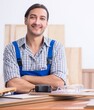 © Elnur - Young male carpenter working indoors