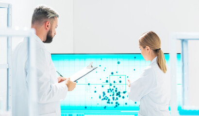 Wall Mural - Team of professional scientists working on a vaccine in a modern scientific research laboratory. Genetic engineer workplace. Future technology, healthcare and science.