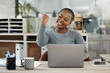 © Sivu G/peopleimages.com - Black woman, laptop and celebration with fist for winning, success or promotion bonus at office. Happy business woman employee in joyful happiness on computer for win, prize or good news at workplace