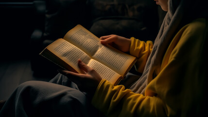 Wall Mural - Reading vintage opened books in dark lights 