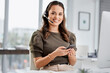 © Graham F/peopleimages.com - Call center, portrait or happy woman typing on smartphone on break with smile in customer services. Telecom, relaxing or friendly telemarketing consultant in communication on social media mobile app