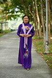 Fototapeta Londyn - Vietnamese senior woman in the park.