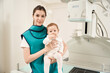 © Svitlana - Young mother and her little child in radiography room