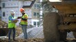 © Robert Peak - Construction site foreman shows tablet computer to woman architect regarding a construction project.
