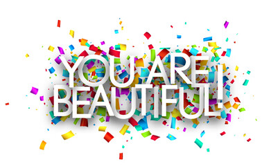 Wall Mural - You are beautiful sign on colorful cut ribbon confetti background.