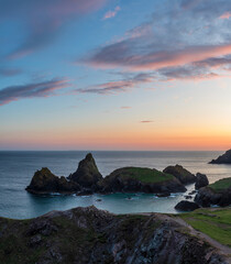 Wall Mural - Beauitful sunrise and sunset landscape image of Kynance Cove in Cornwall England with colourful sky
