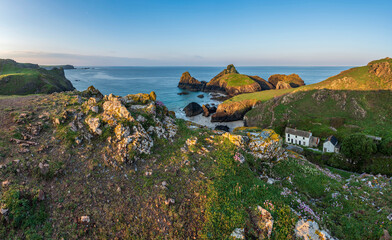 Wall Mural - Beauitful sunrise and sunset landscape image of Kynance Cove in Cornwall England with colourful sky