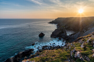 Wall Mural - Beauitful sunrise and sunset landscape image of Kynance Cove in Cornwall England with colourful sky