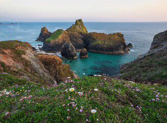 Wall Mural - Beauitful sunrise and sunset landscape image of Kynance Cove in Cornwall England with colourful sky