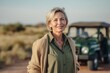 © Robert MEYNER - Medium shot portrait photography of a pleased woman in her 50s that is wearing a chic cardigan against a safari adventure with wildlife encounters background . Generative AI