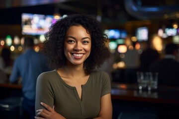 Portrait of a smiling african american woman in a bar