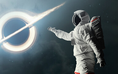 Canvas Print - astronaut explores a black hole in deep space. 5k realistic science fiction art. elements of image p