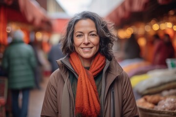 Wall Mural - Medium shot portrait photography of a pleased woman in her 40s that is wearing a warm parka against a traditional moroccan market with bright colors and flavors background . Generative AI