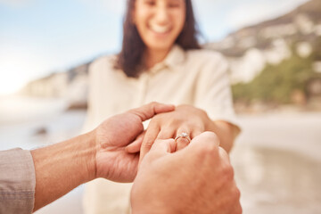 Pov, engagement and woman with ring on hand at beach with smile, love and happy couple vacation. Man, woman and jewelry with marriage offer by ocean with diamond, excited face or together on holiday