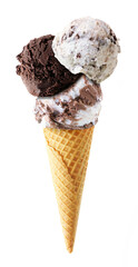 Wall Mural - Triple scoop ice cream cone isolated on a white background. Cookies and cream, dark chocolate and heavenly hash flavors in a waffle cone.