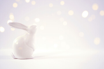 Wall Mural - Easter Spring baby theme background, banner, framed border backdrop. Minimal styling with bunny rabbit against a bokeh party lights background. Negative copy space.