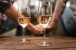 © kieferpix - Cheers to Togetherness, Man woman Enjoying Wine and Refreshments  Celebration holding hands