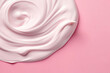 © SnowElf - Top view of a smear of white thick cream isolated on a pastel pink background surface with copy space. Cosmetic cream, white paint. Generative AI professional photo imitation.