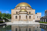 Fototapeta Londyn - Akhmediye Mosque building with golden dome in Akhaltsikhe (Rabati) Castle courtyard with its reflection in a pond, symmetrical view.