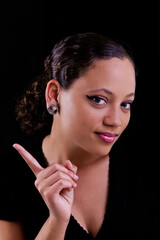 Wall Mural - Portrait Of Attractive African American Woman On Dark Background