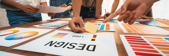 Wall Mural - graphic designer brainstorm logo and graphic art at busy creative studio workshop. experiment and br