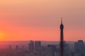 Panoramic aerial view of Paris, Eiffel Tower and La Defense business district. Aerial view of Paris at sunset. Panoramic view of Paris skyline with Eiffel Tower and La Defense. Paris, France.