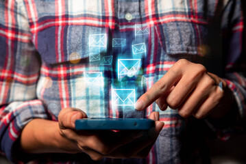 Poster - businessman using smart phone sending email on virtual screen, email marketing concept, sending mass e-mails or digital newsletter to manage relationship with customers